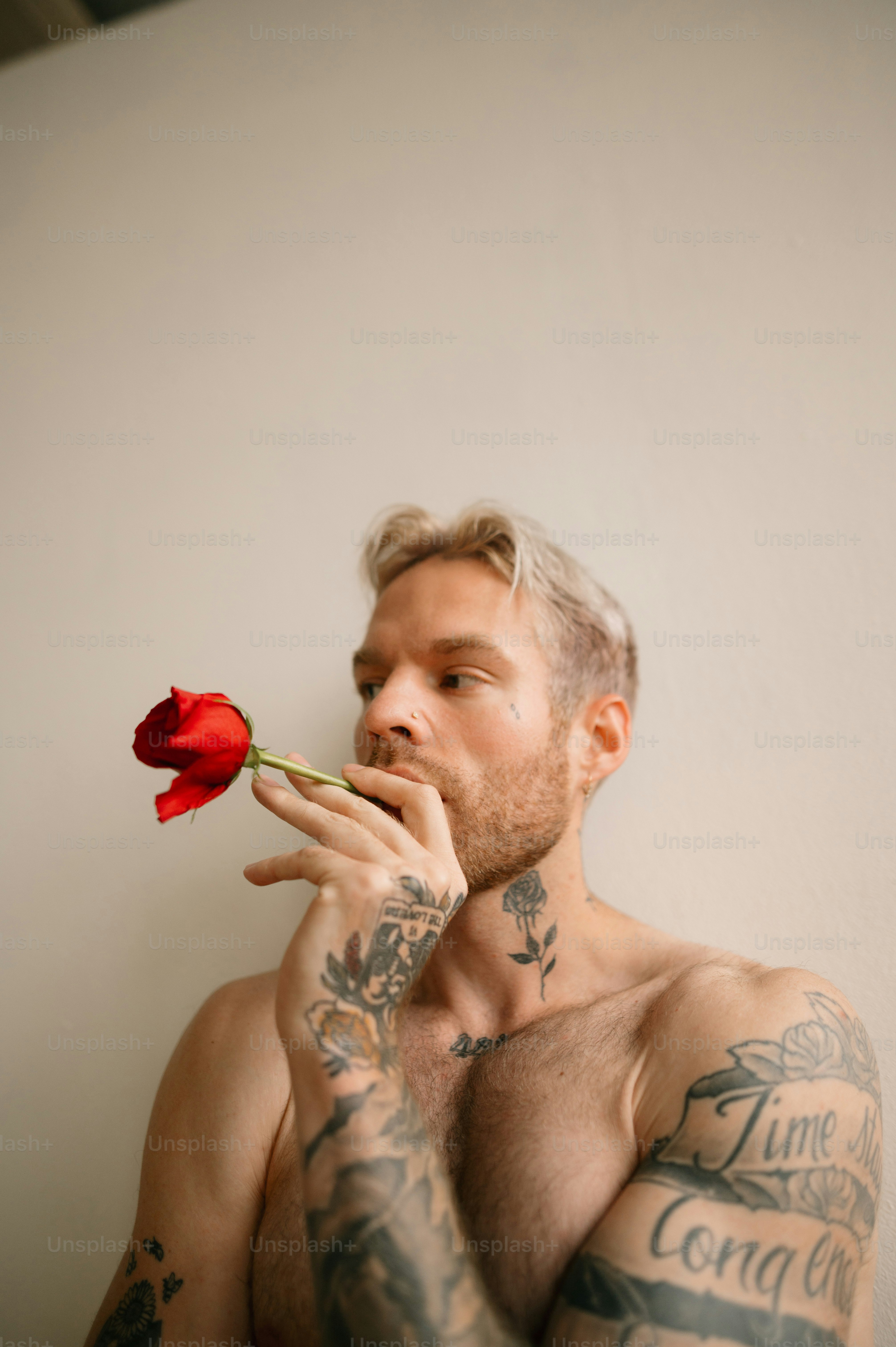 a person with a rose in the mouth