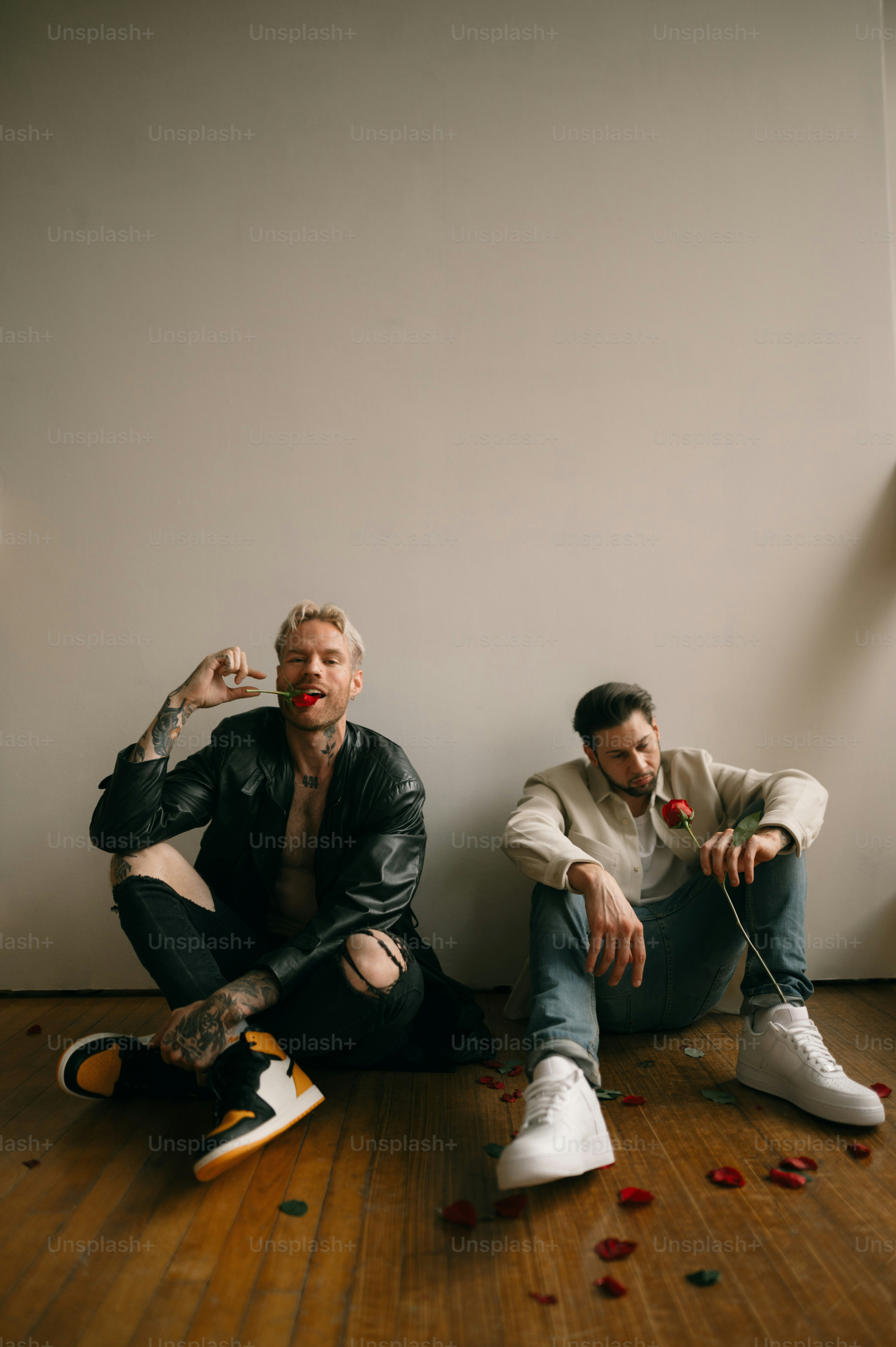 two men sitting on the floor