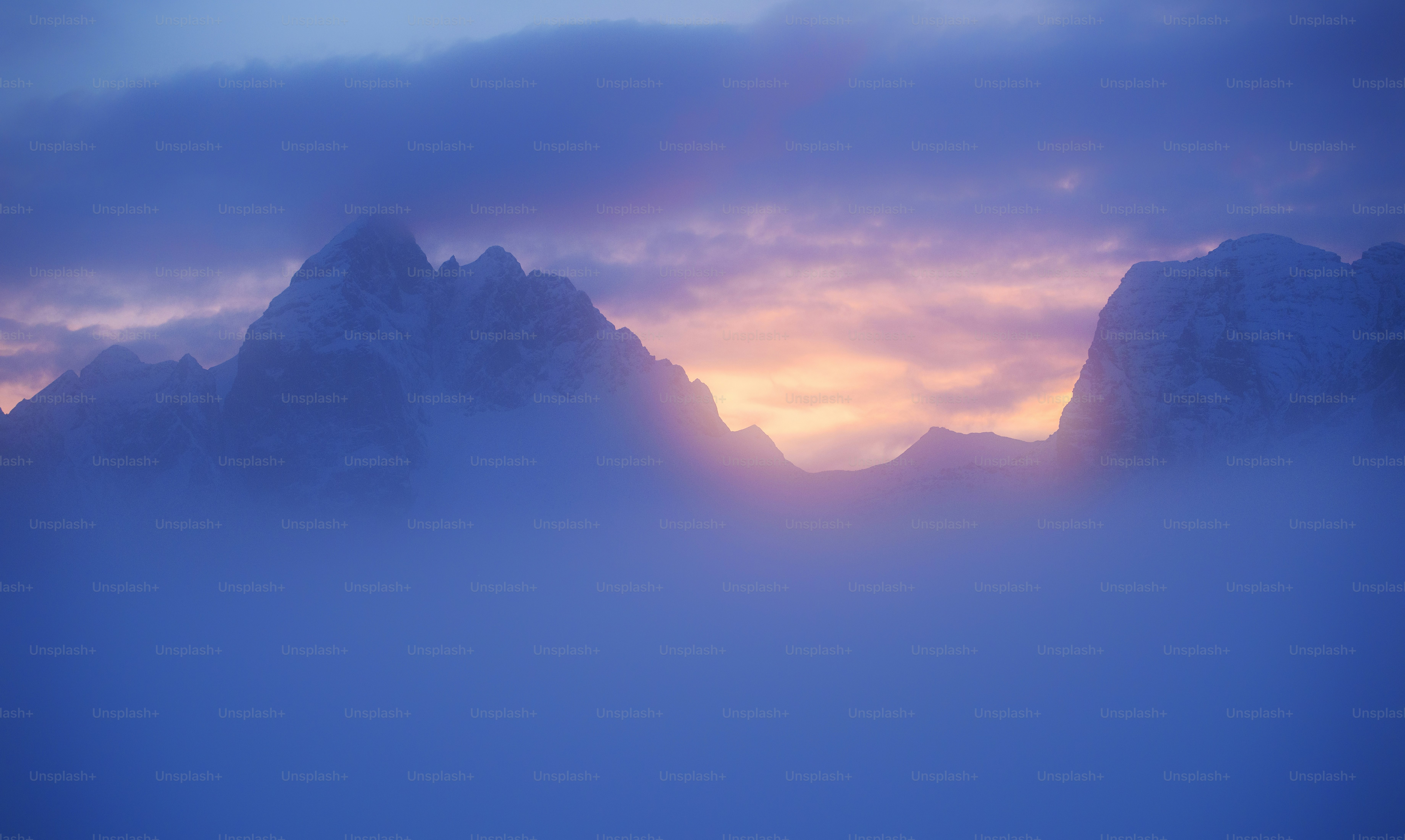 a mountain with clouds