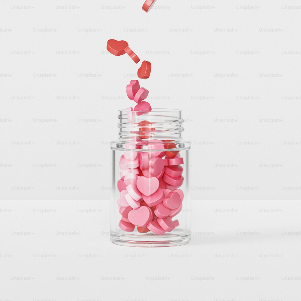 a glass with a pink ribbon