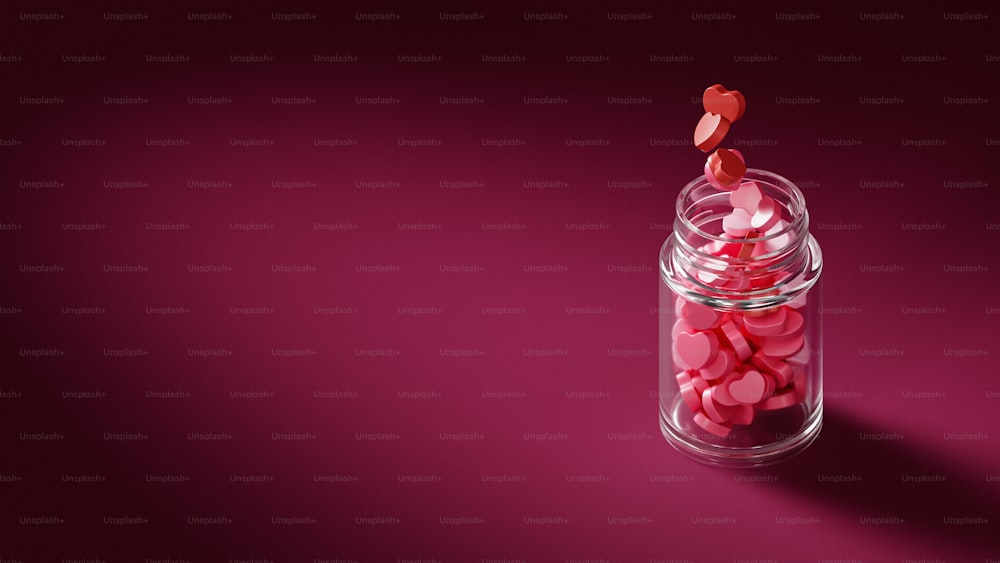 a glass jar with a pink liquid