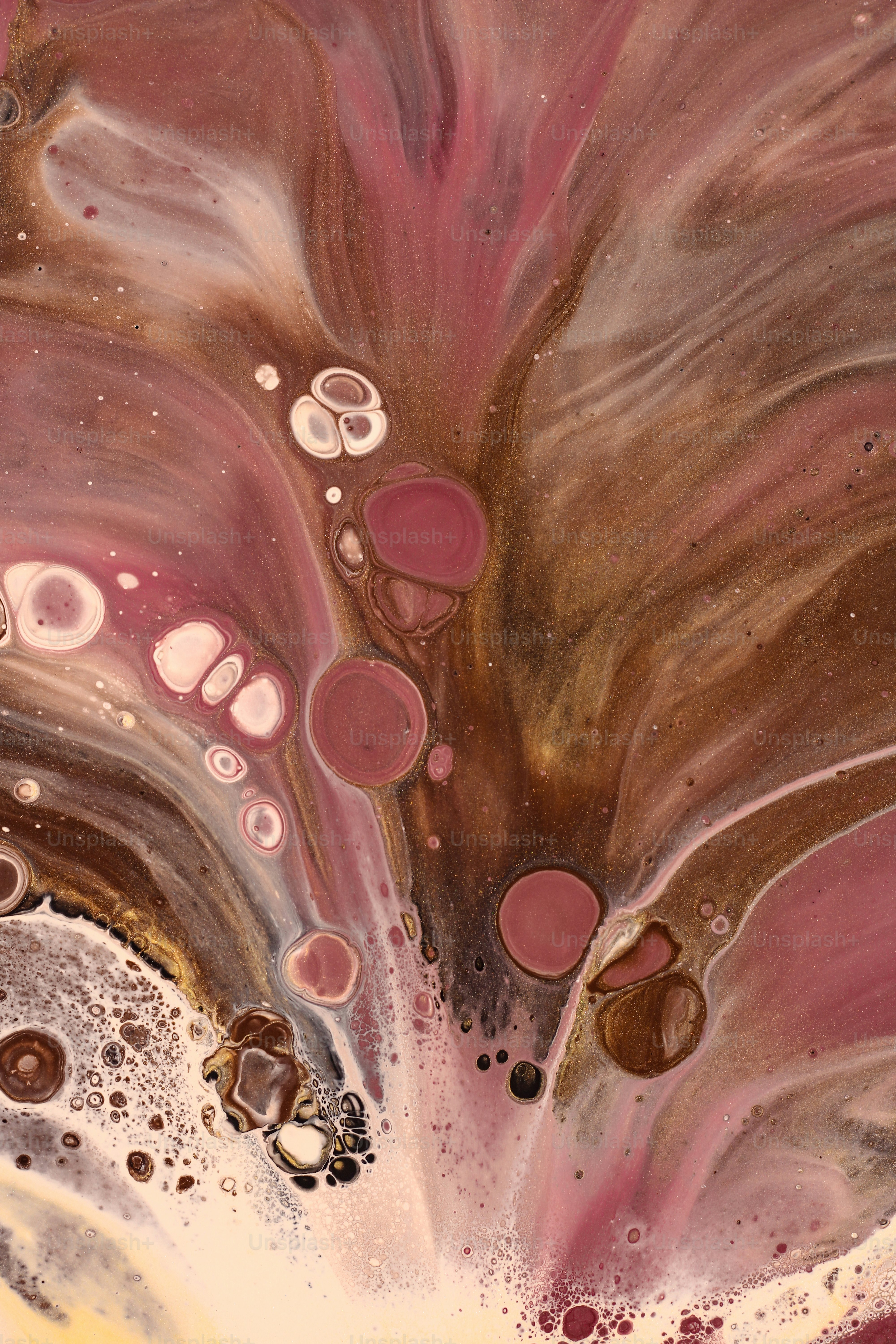 a close up of a pink and brown liquid