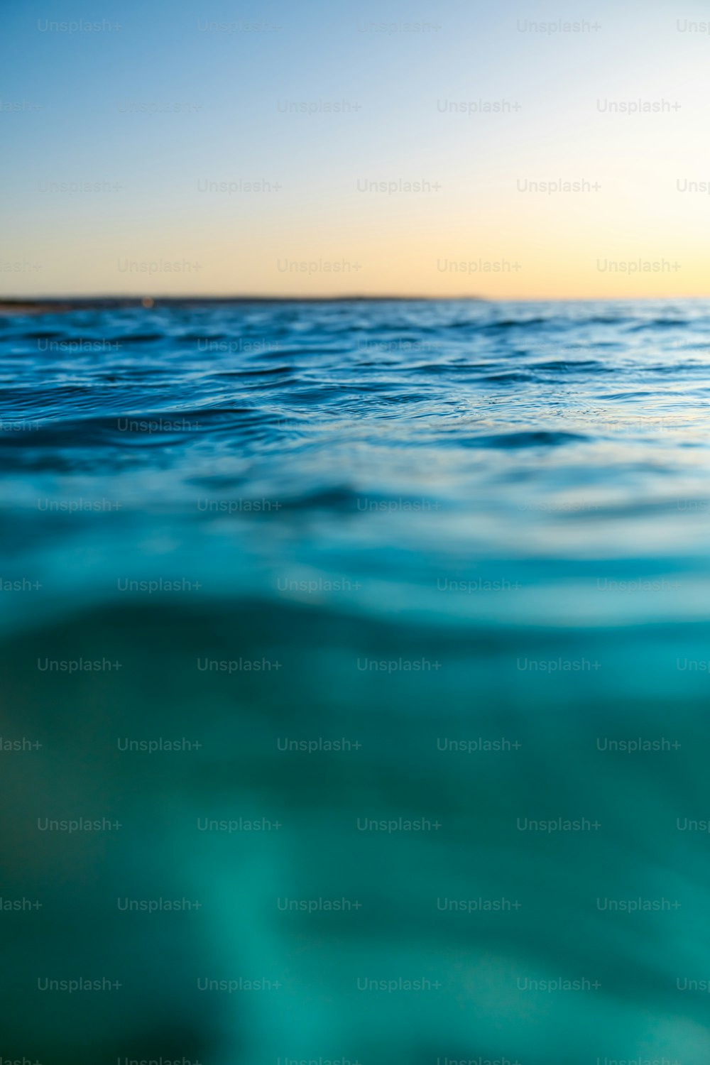 A body of water with a blue sky above it photo – Wallpapers Image ...