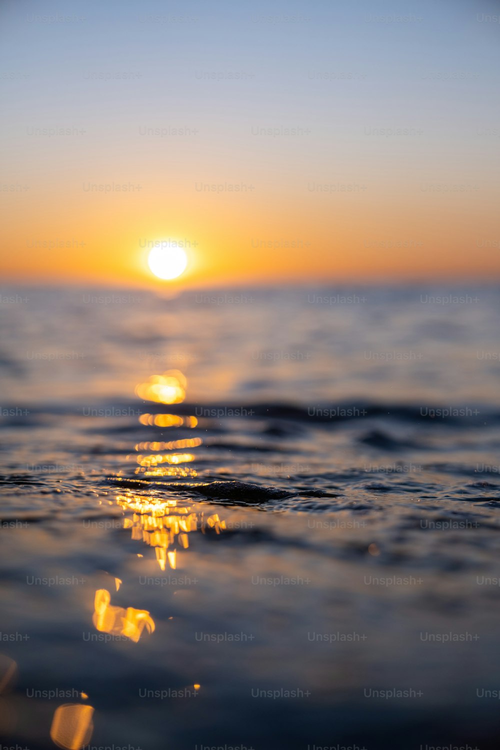 a sunset over a body of water