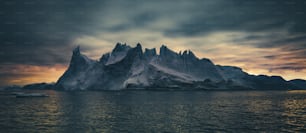 a body of water with a mountain in the distance