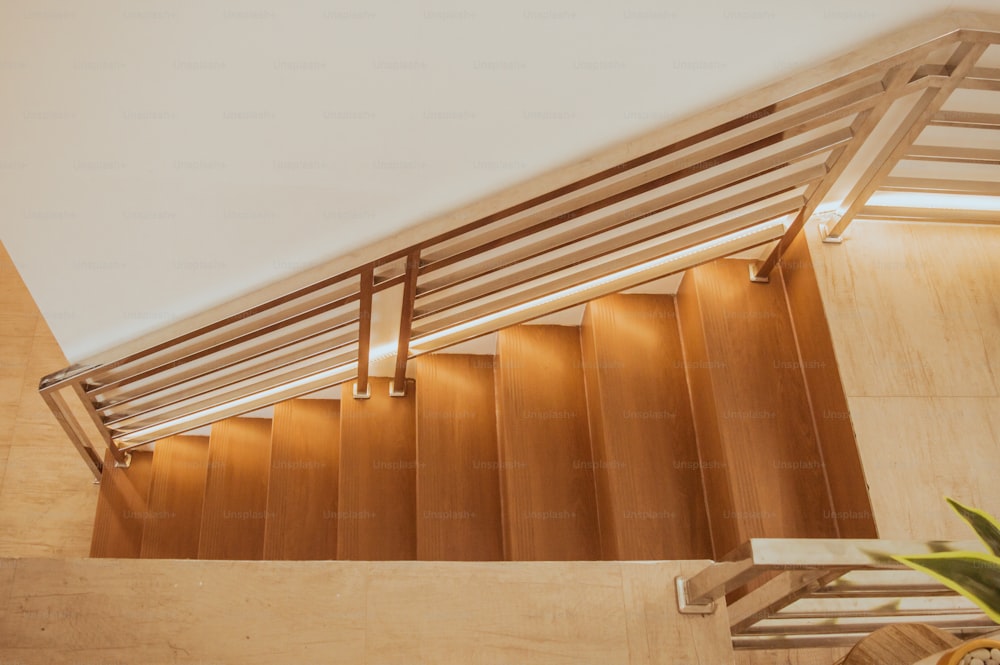 a wooden staircase with a railing