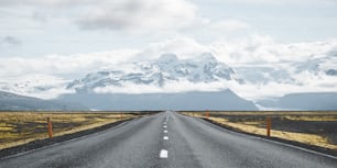 a road with snow covered mountains