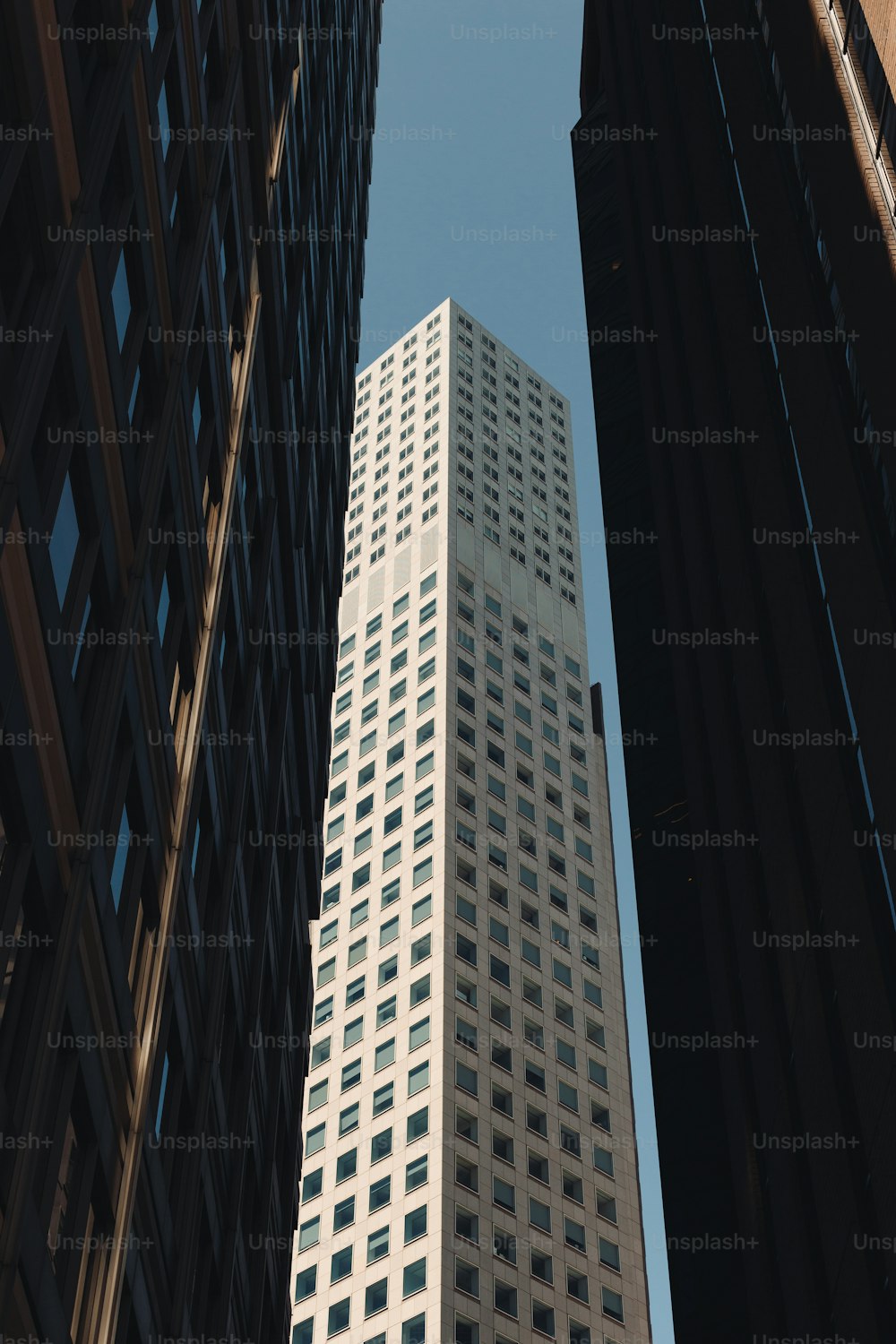 a view of a tall building from the ground