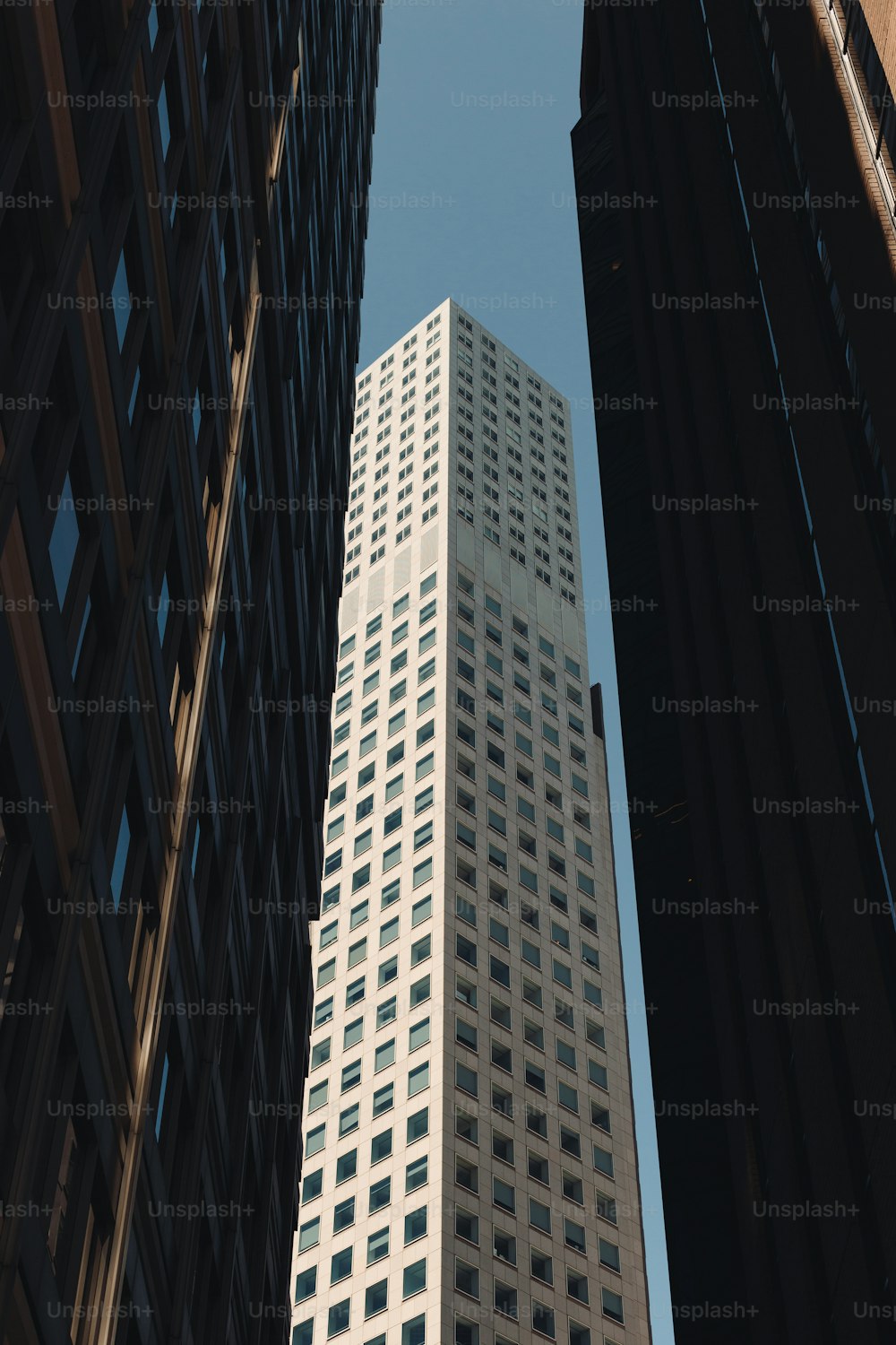 a view of a tall building from the ground