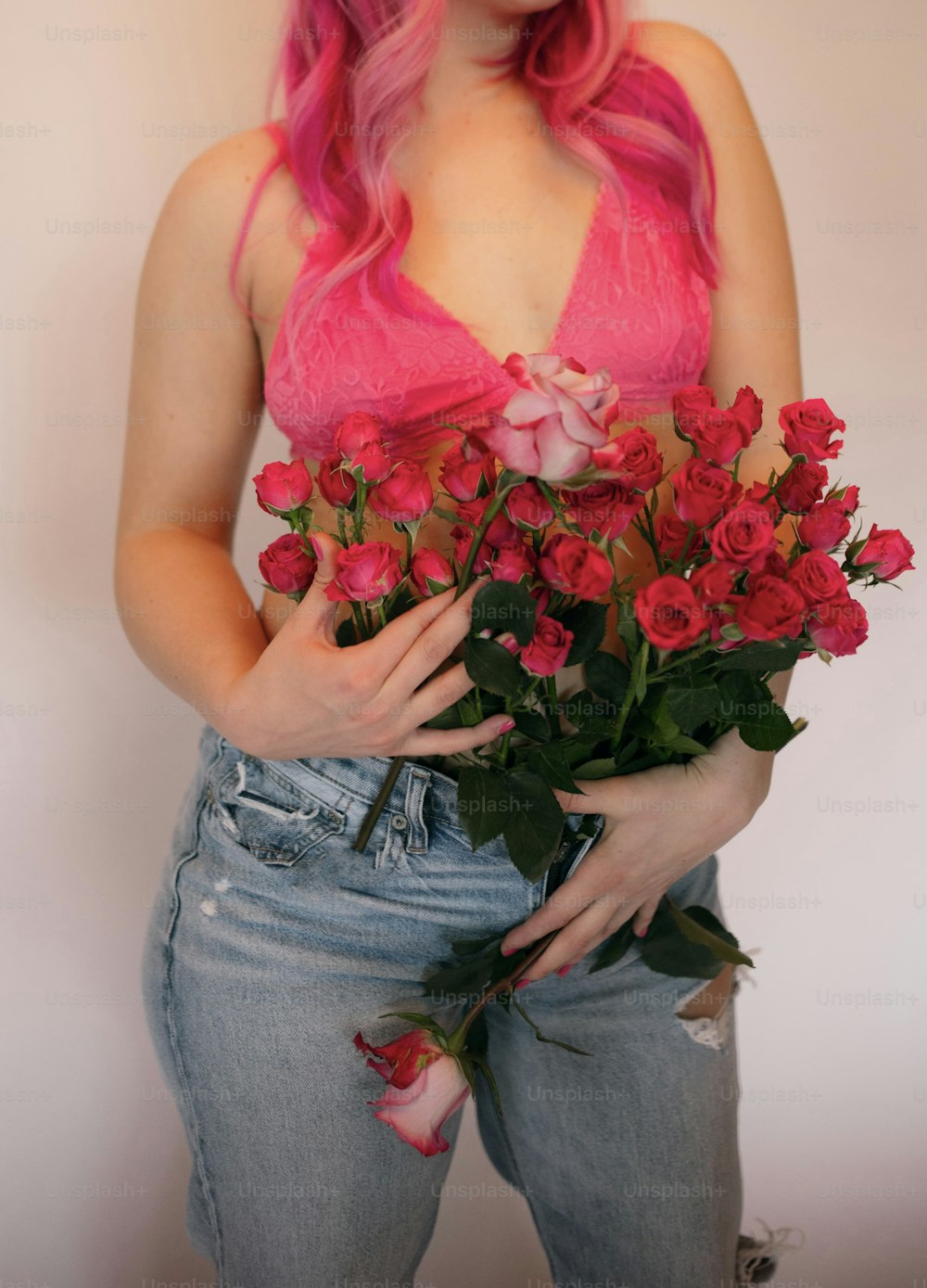 a woman holding a bouquet of flowers