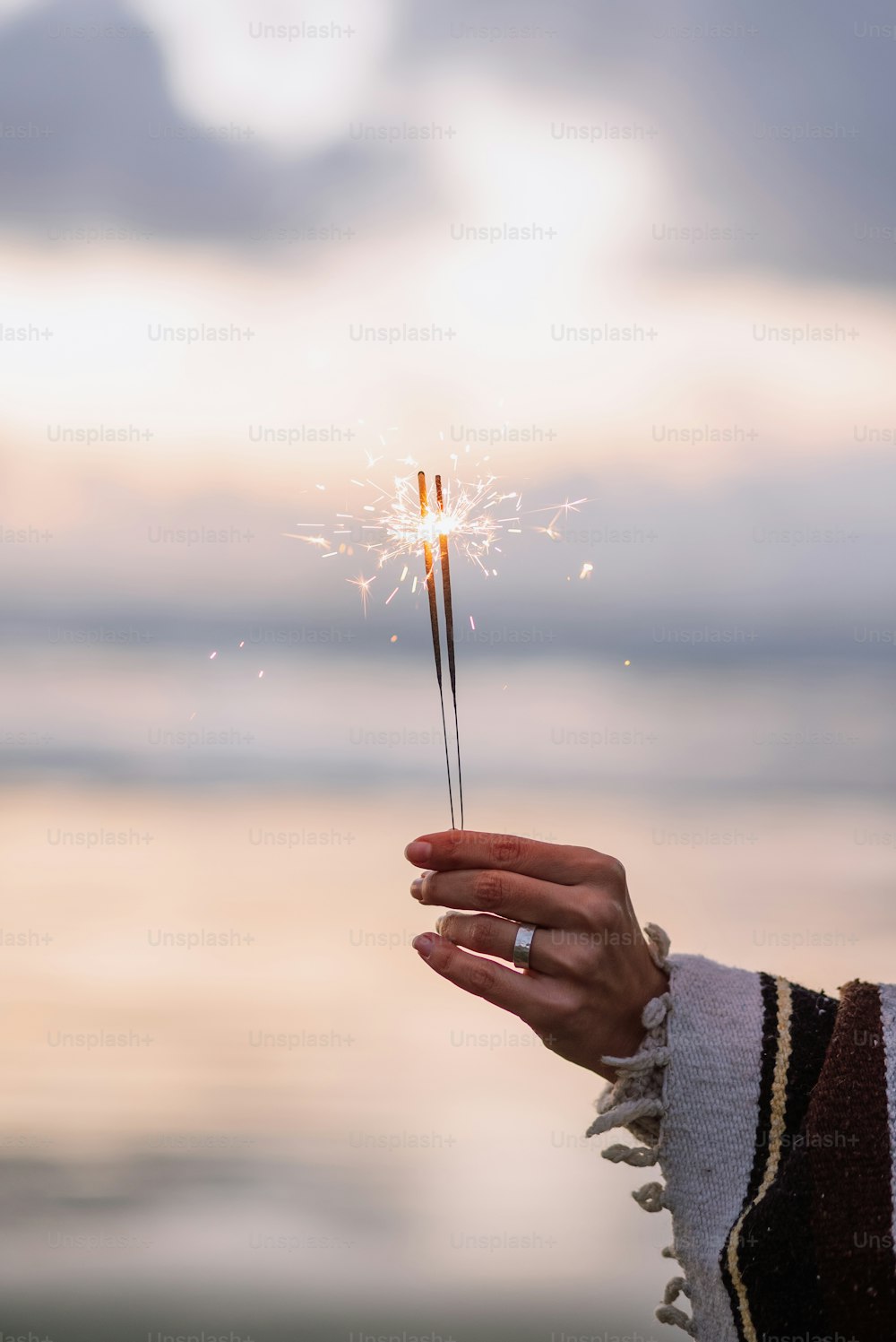 a person holding a sparkler