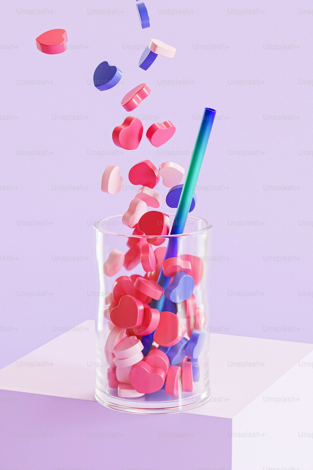a glass with a straw and candy in it