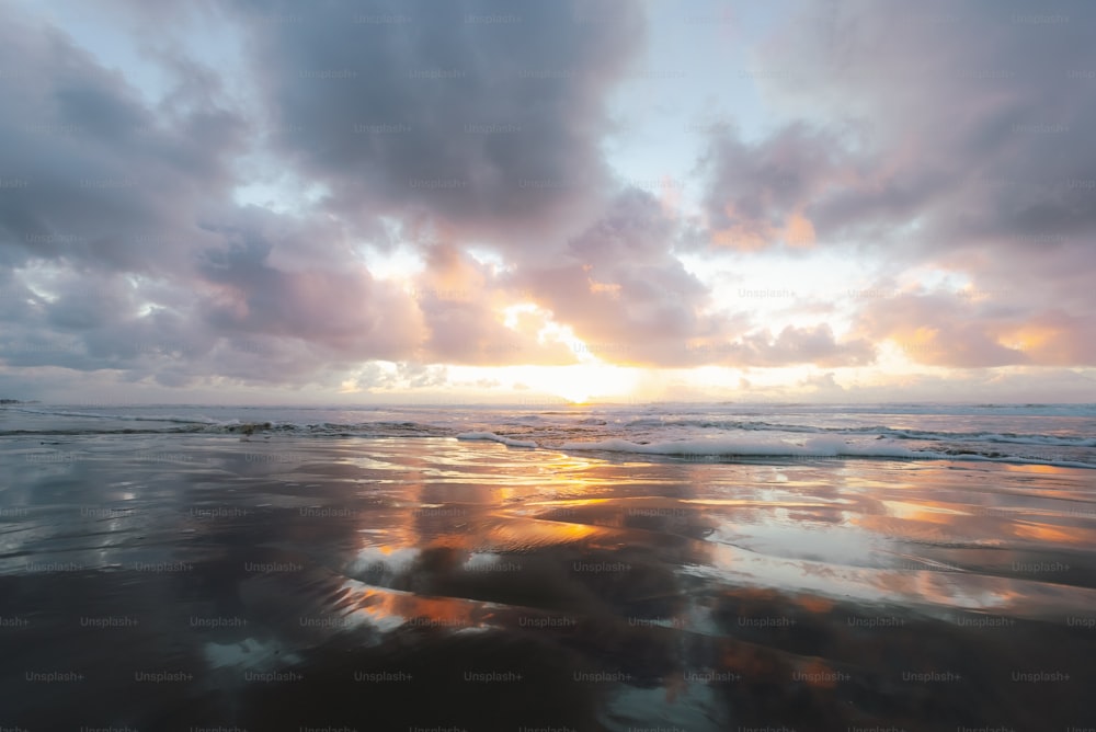 a beach with a sunset