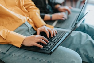 a person typing on a laptop