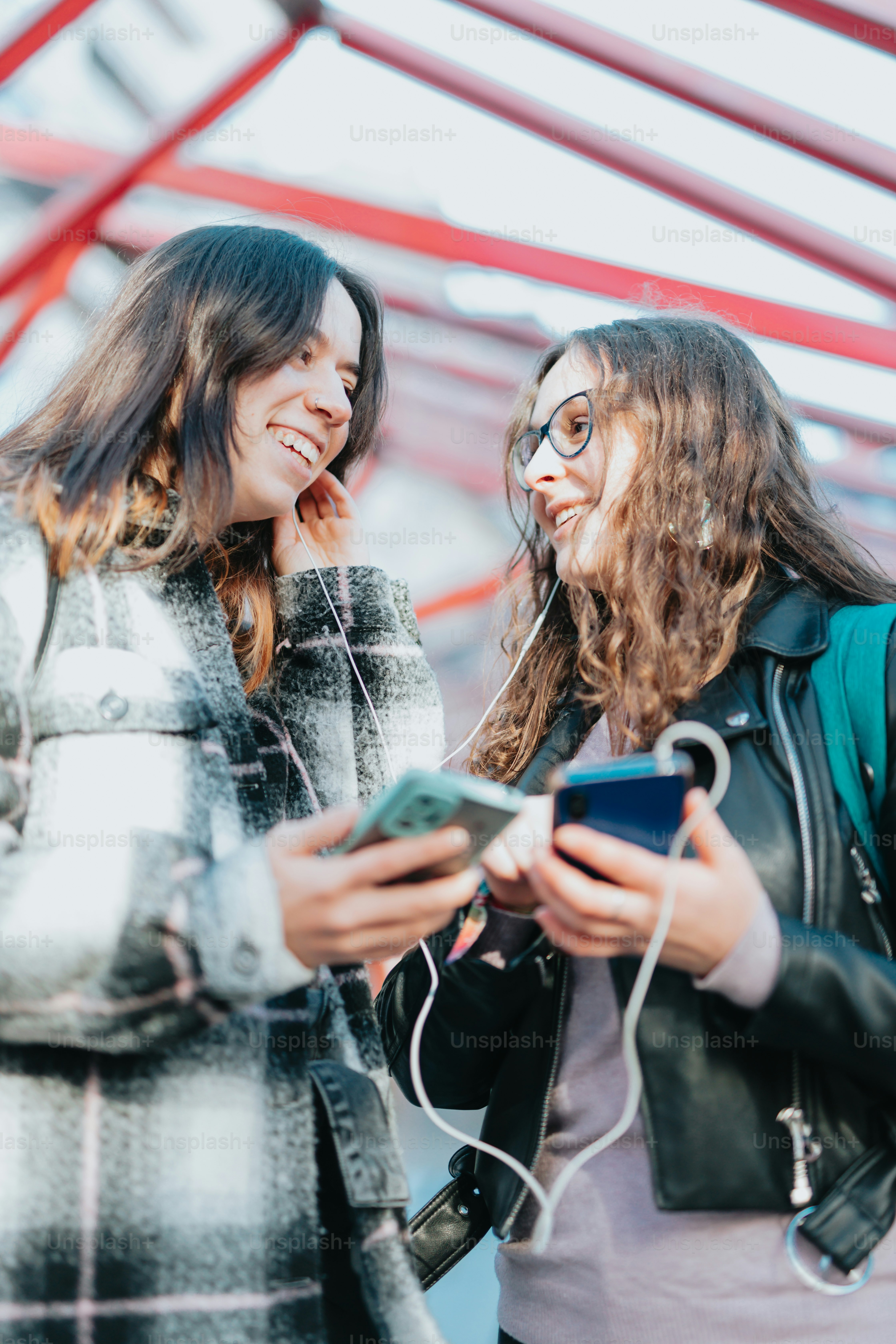 women looking at their phones