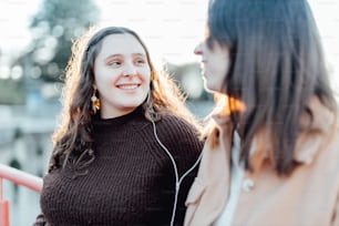 a woman smiling at another woman