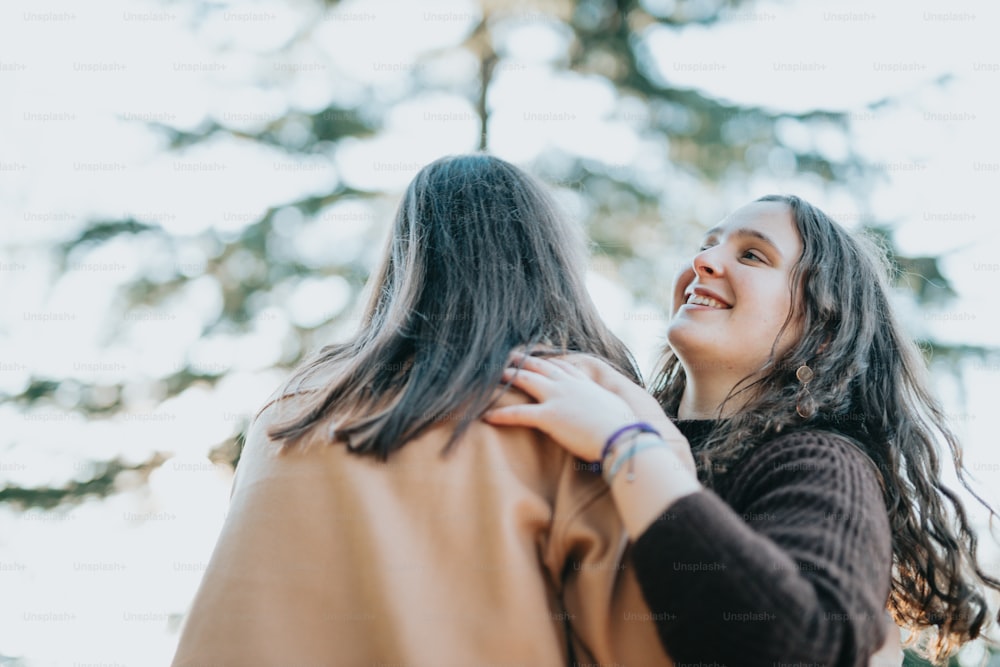 a person holding another woman