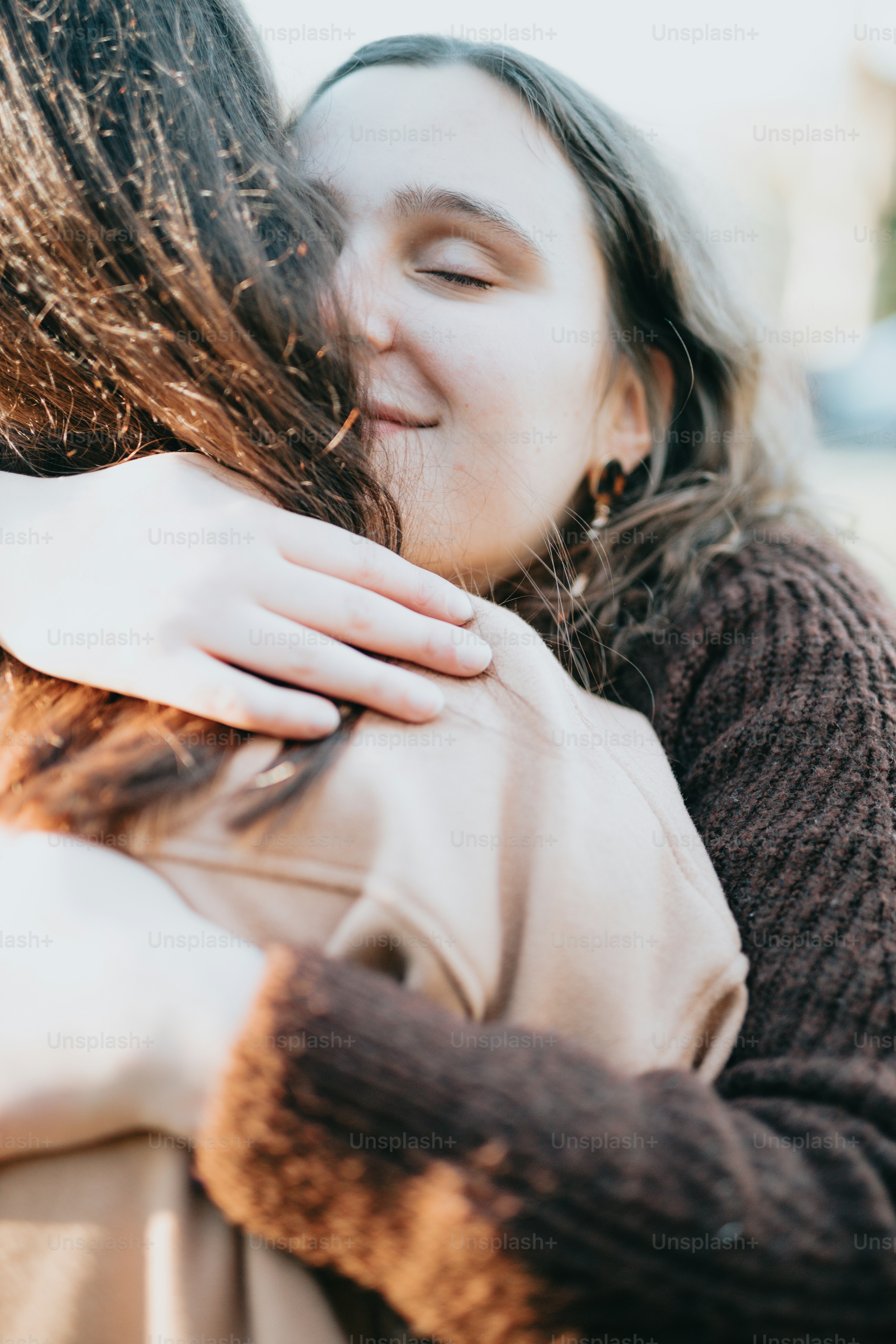 a woman with her hand on her face