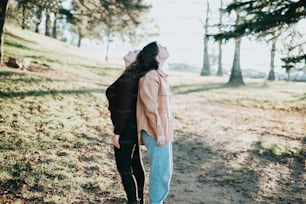 a person kissing another woman on the cheek