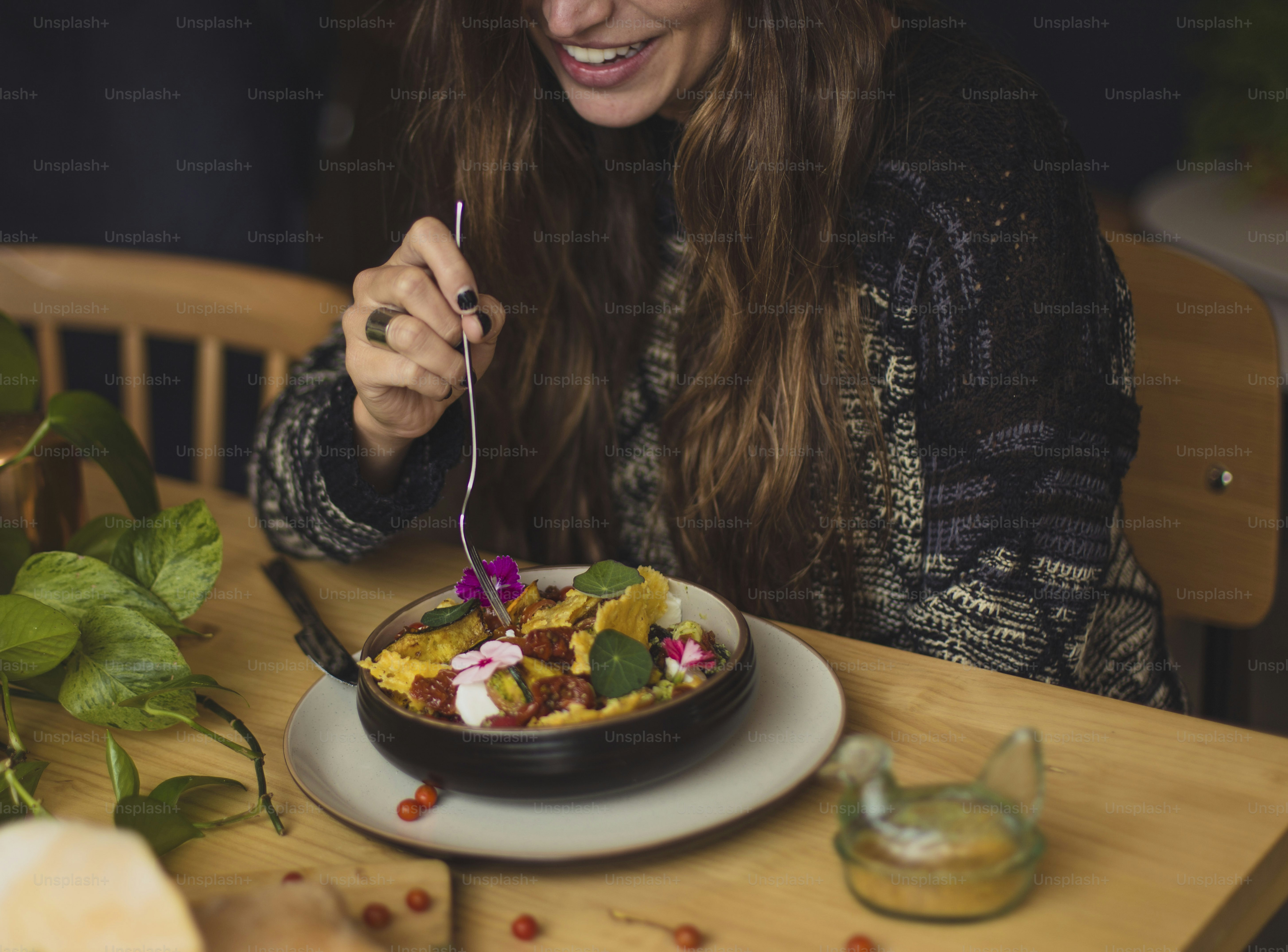 a woman eating a cake