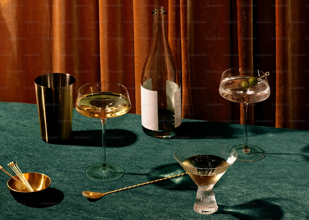 a table with glasses and candles