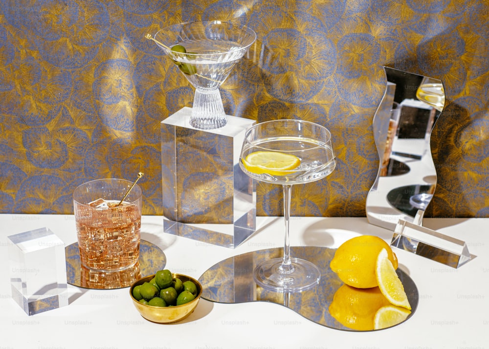 a table with glasses and fruit