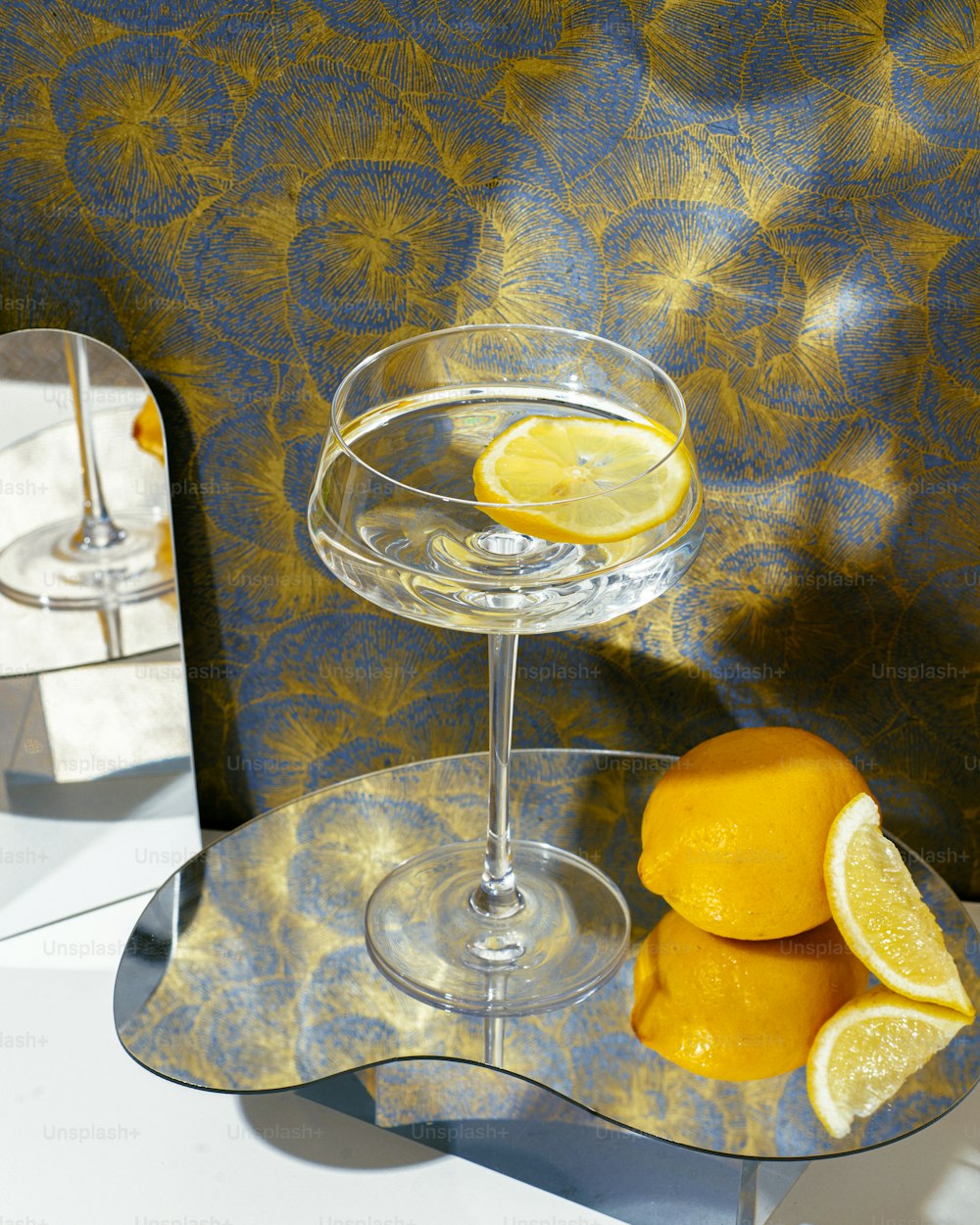 a glass of champagne with lemons