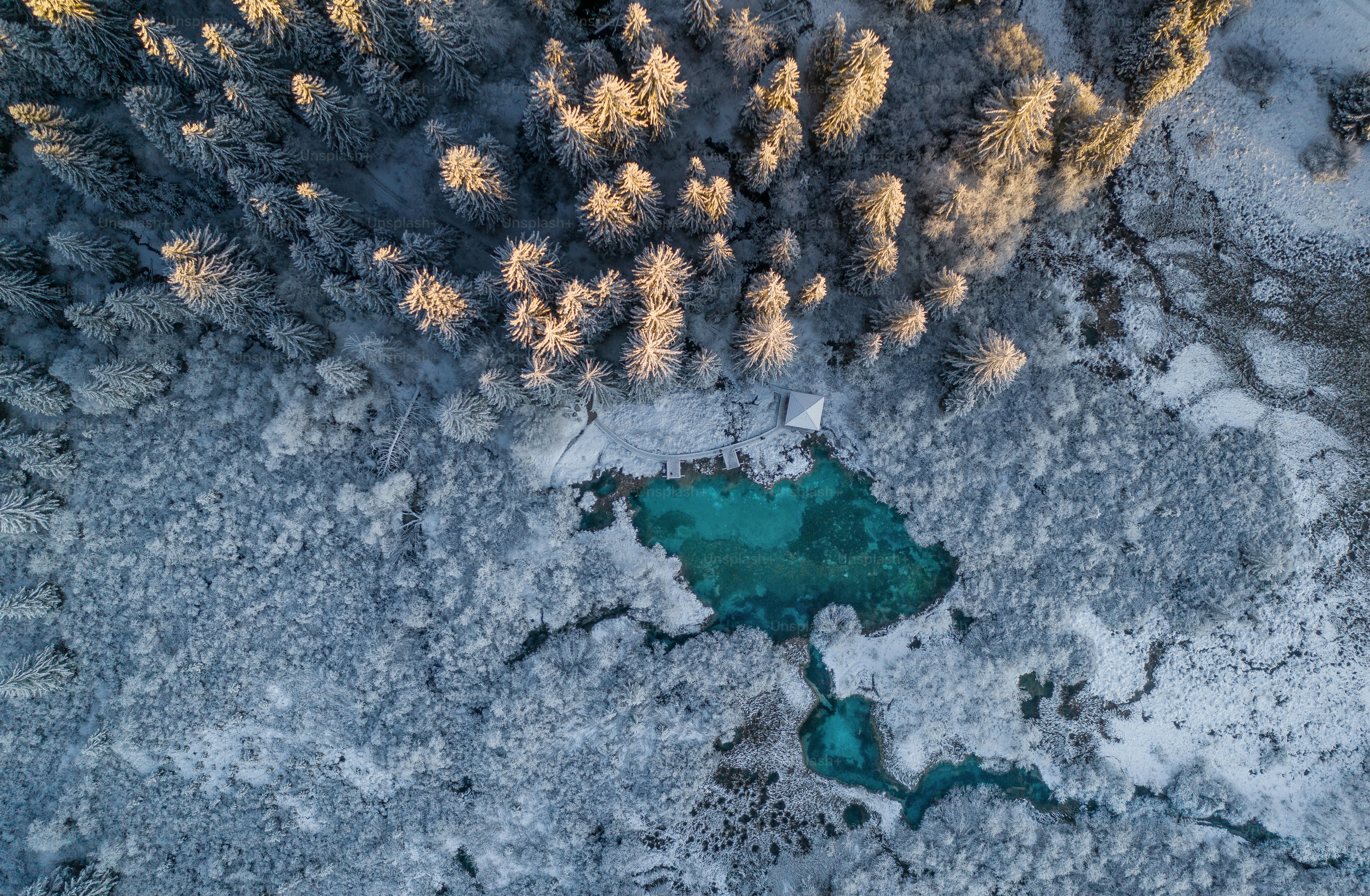 Winter morning by the emerald lake in the Julian Alps in Europe.