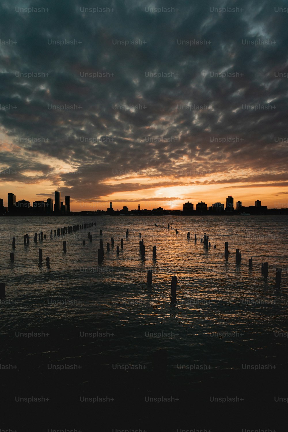 a body of water with a city in the background