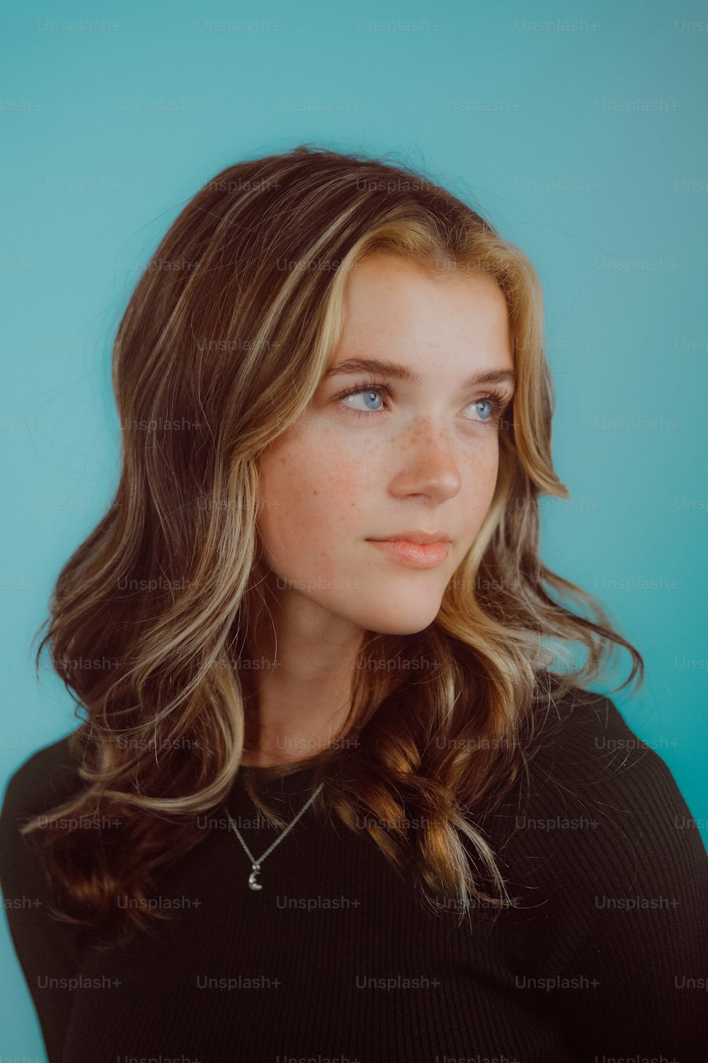 a woman with long hair and a black shirt