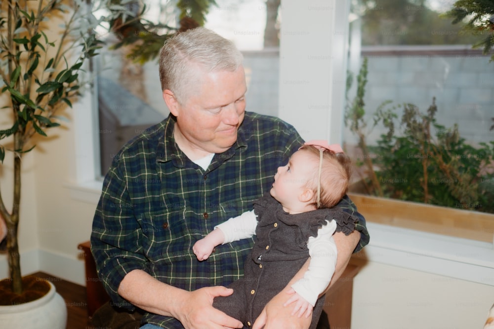 a man holding a baby