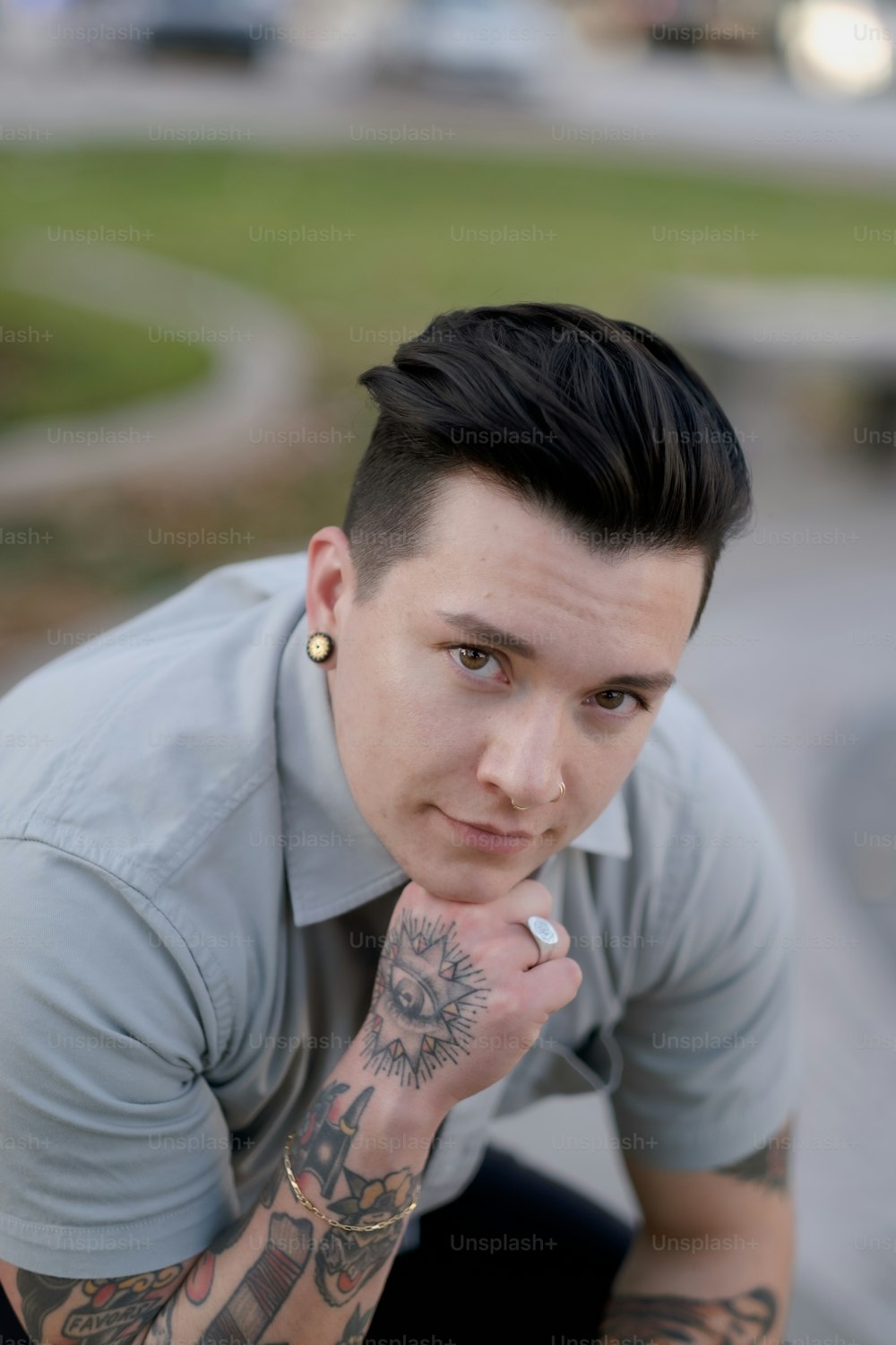 a man with tattoos posing for the camera