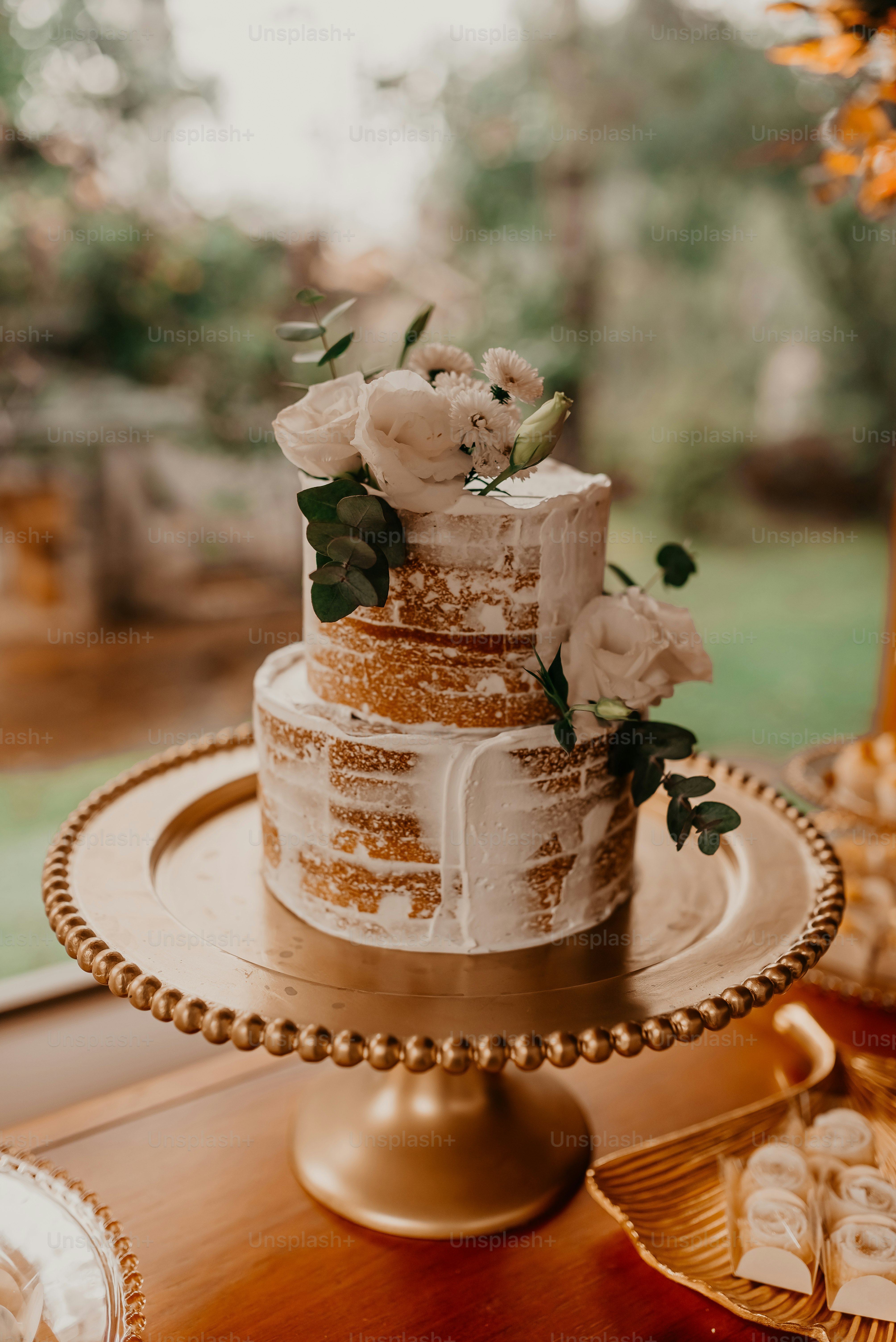 a cake with white frosting