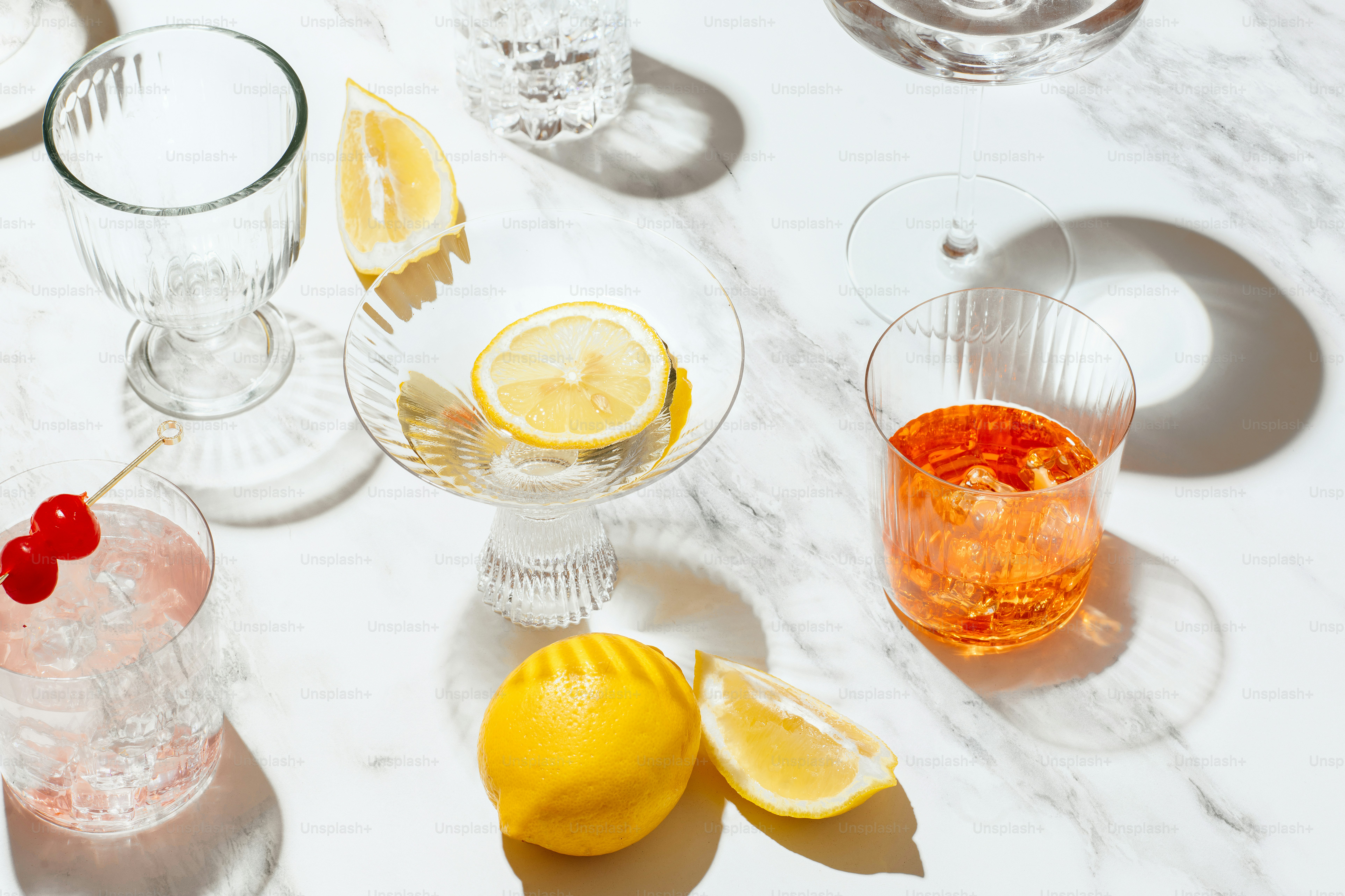 a table with glasses and fruit