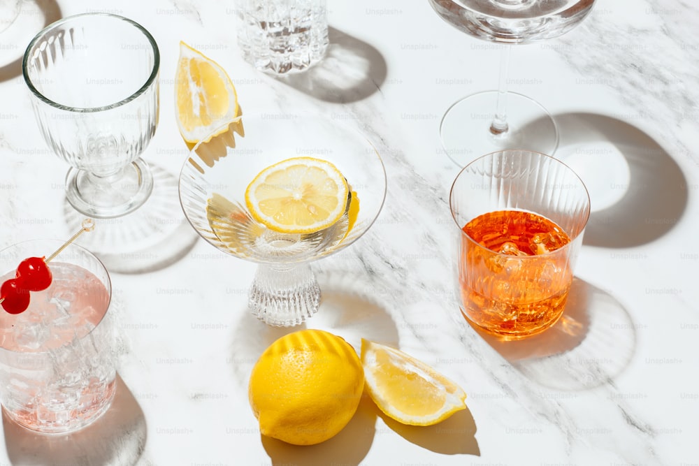 a table with glasses and fruit