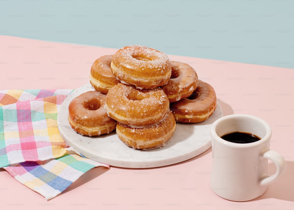 a plate of donuts and coffee