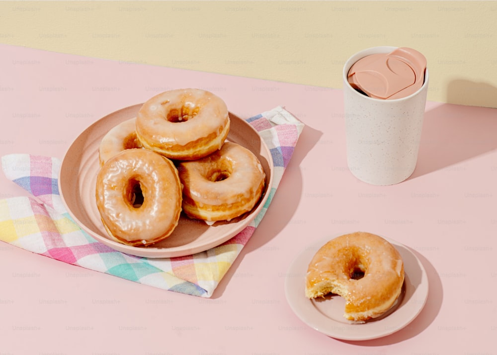 a plate of donuts and a cup of coffee