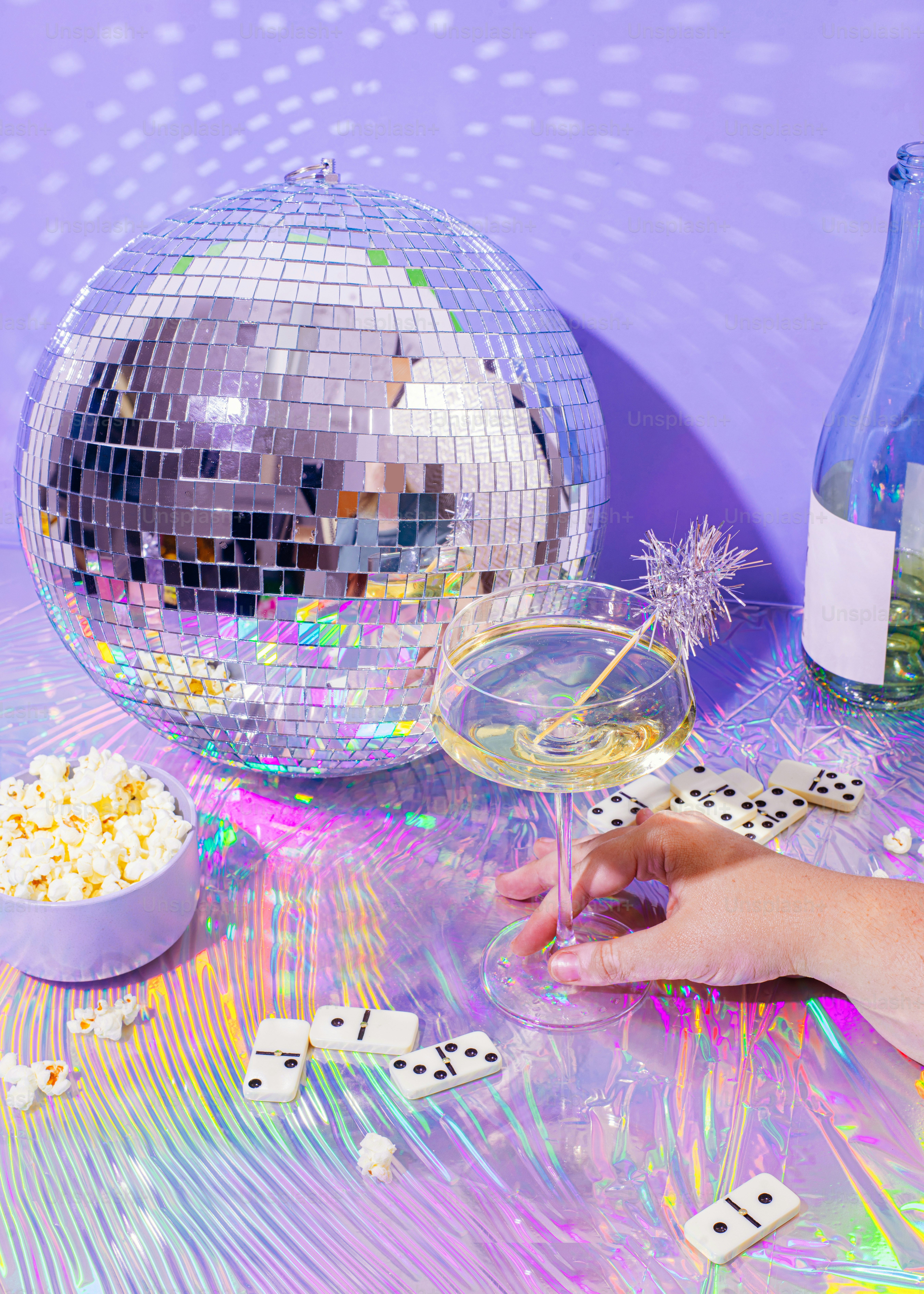 a hand holding a glass of wine