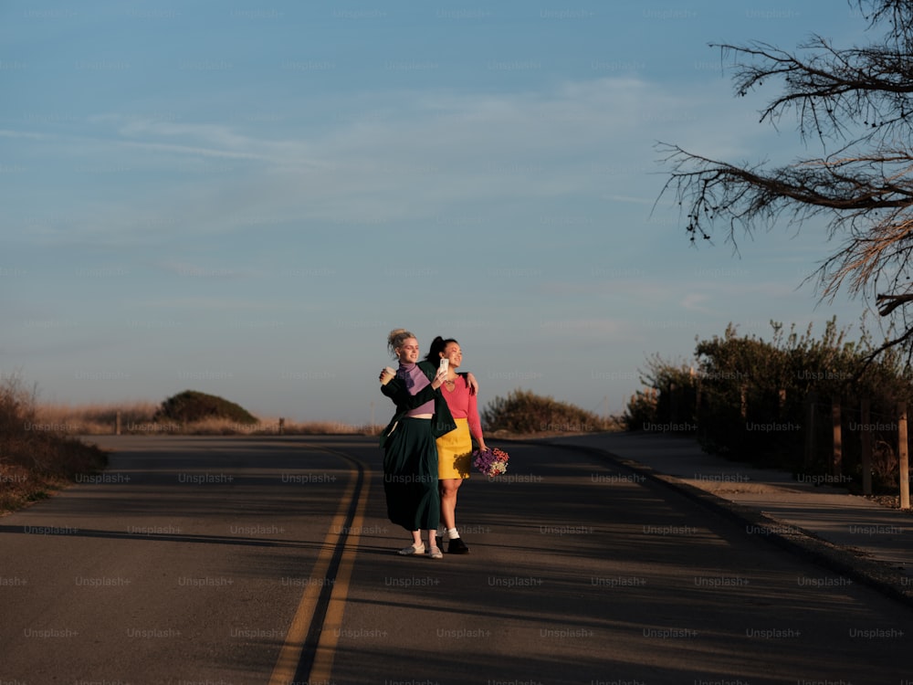 a man and woman kissing on a road