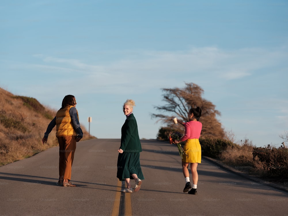 a group of people walking on a road