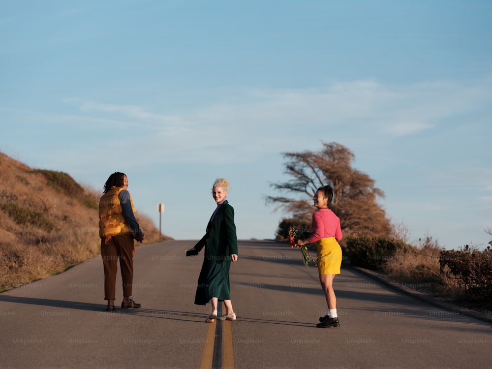 a group of people walking on a road