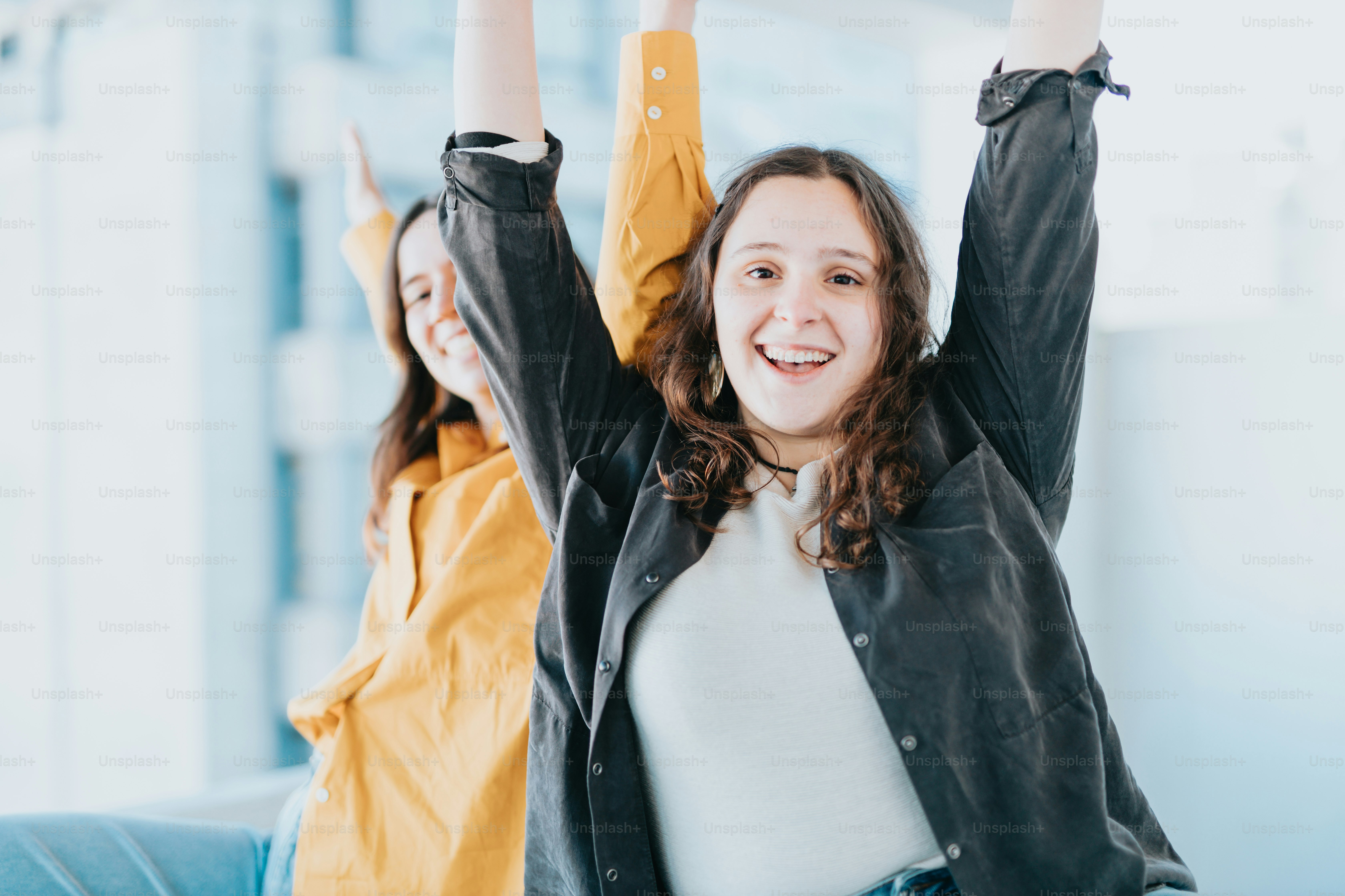 a woman holding her hands up