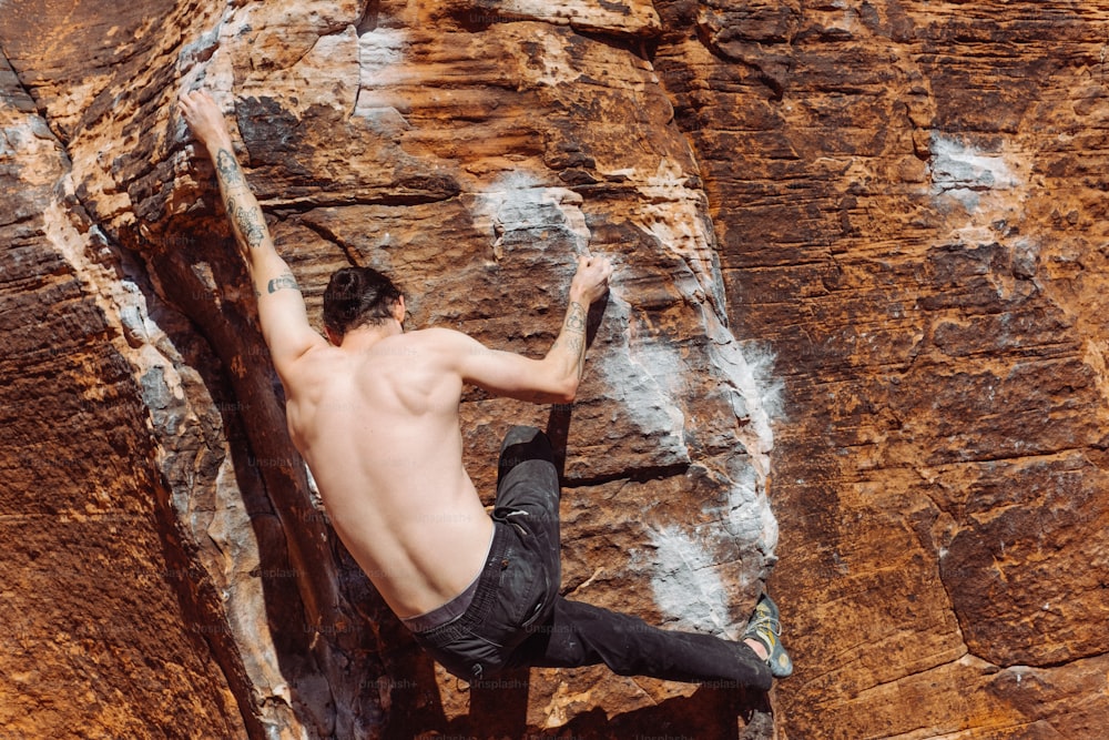 a person climbing a rock wall