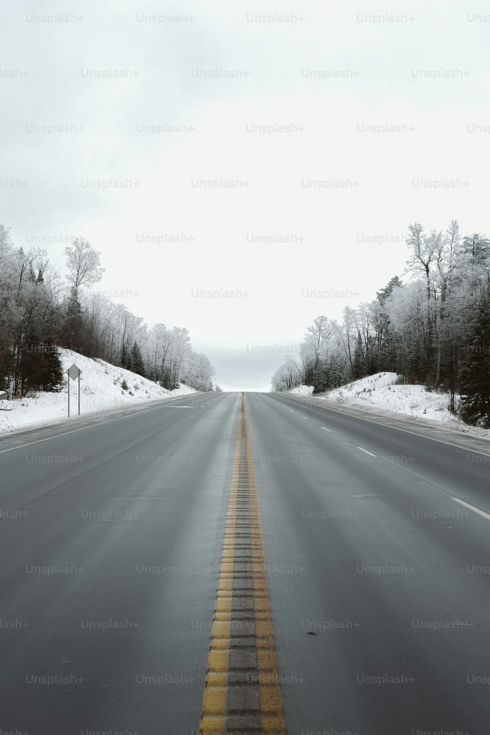 a road with a yellow line on the side of it