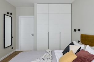 a bedroom with white walls