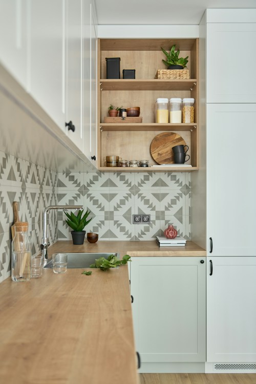 Professional contractor reviewing kitchen cabinet plans