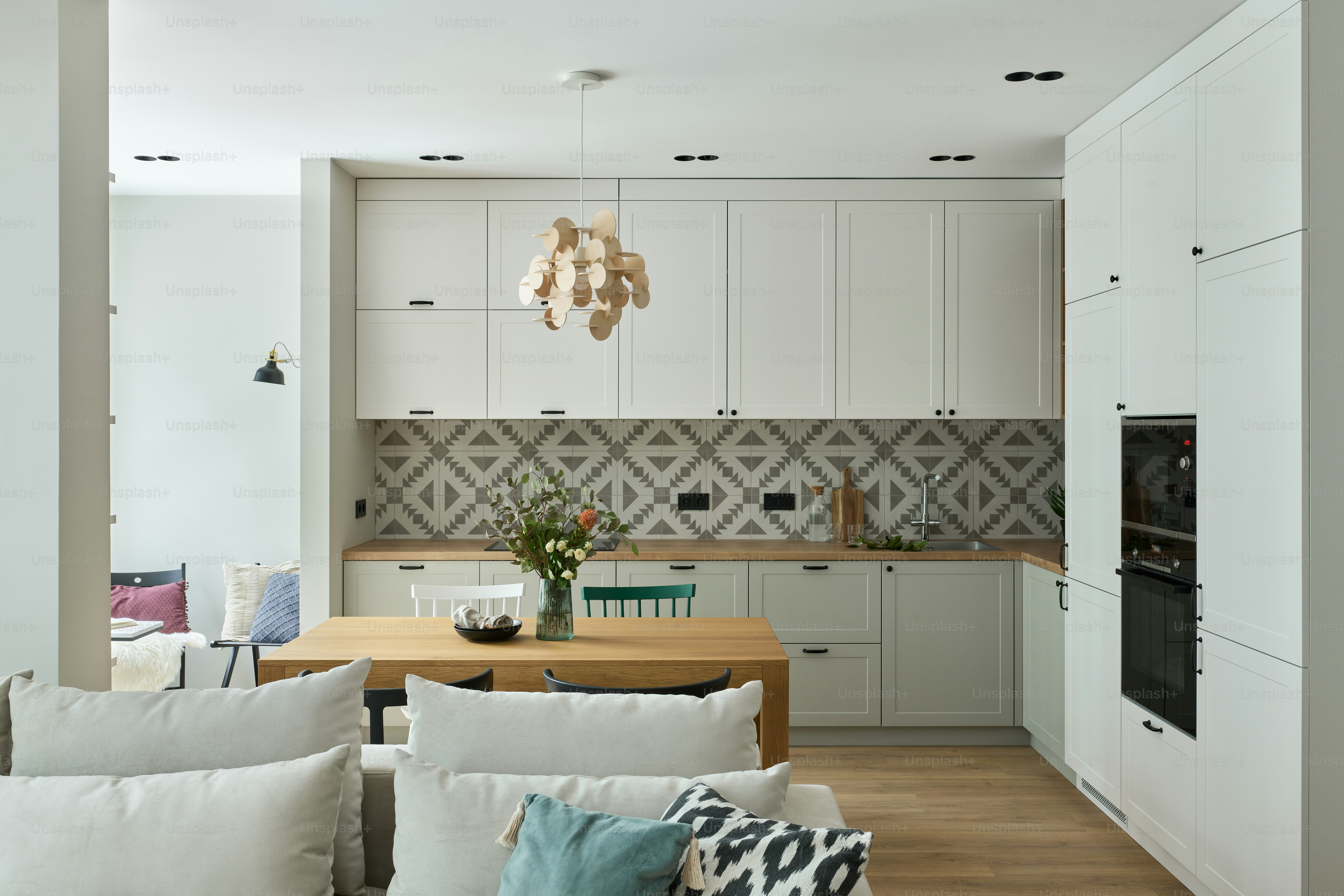a kitchen with white cabinets