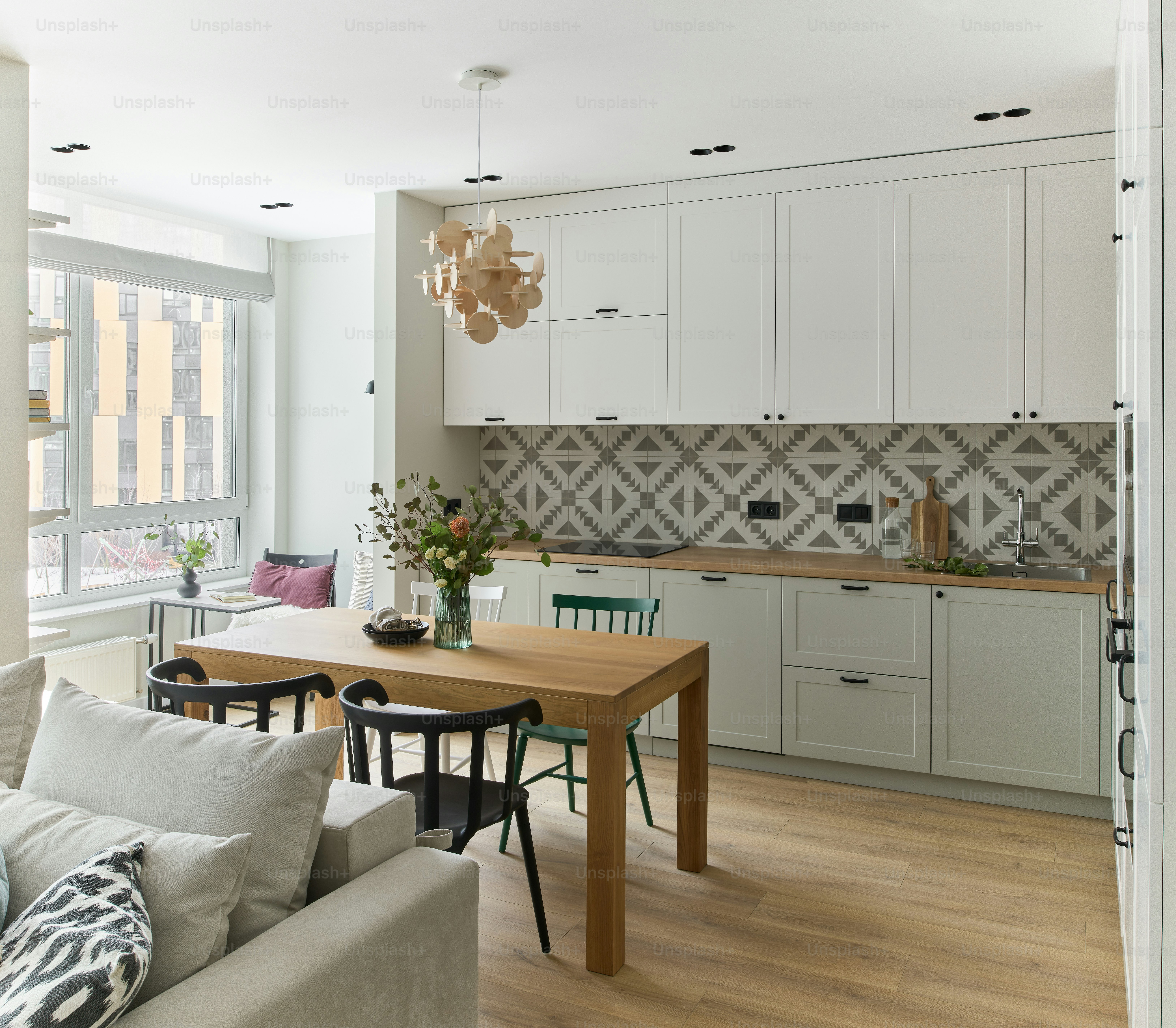 a kitchen with white cabinets