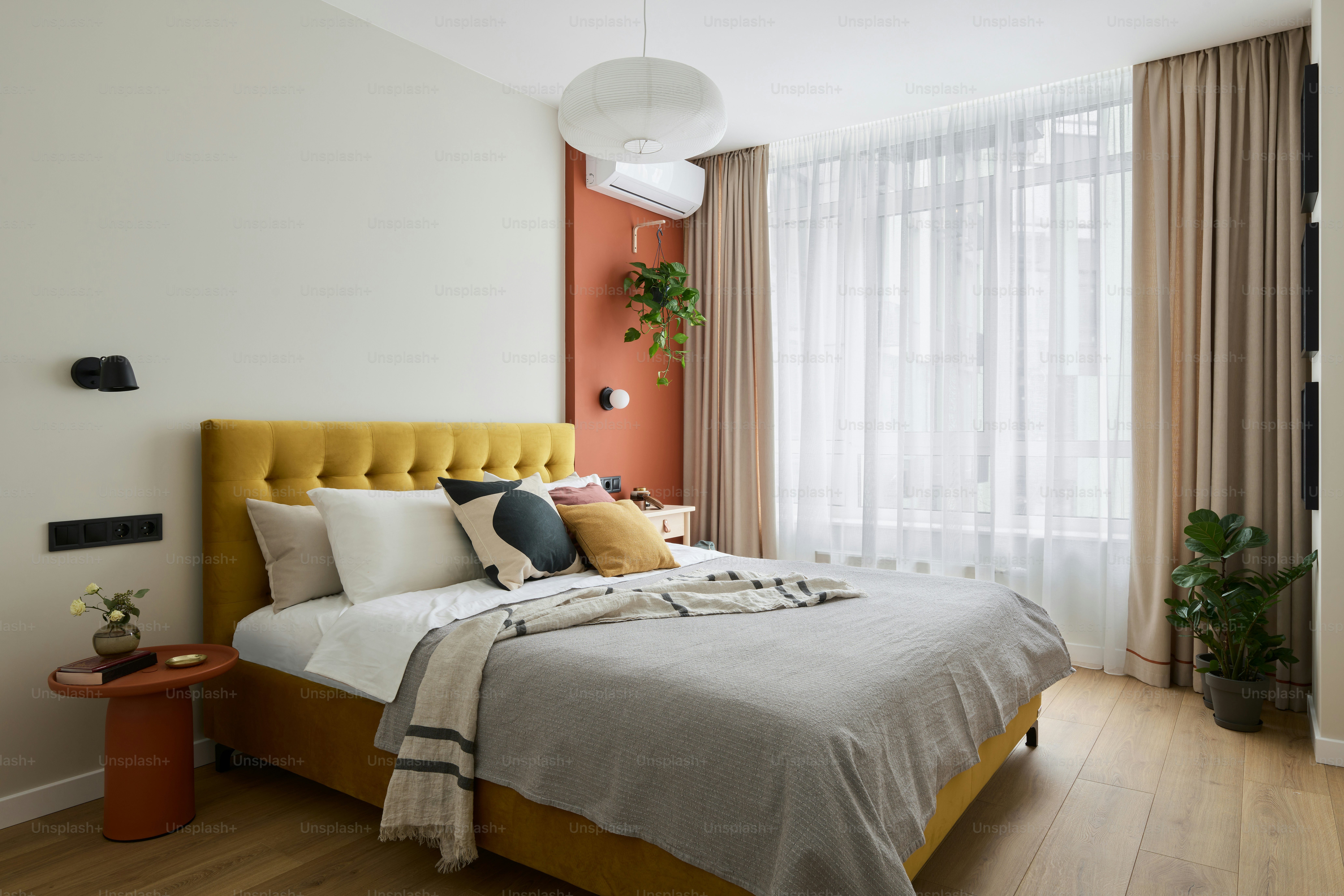 a bed with a yellow headboard