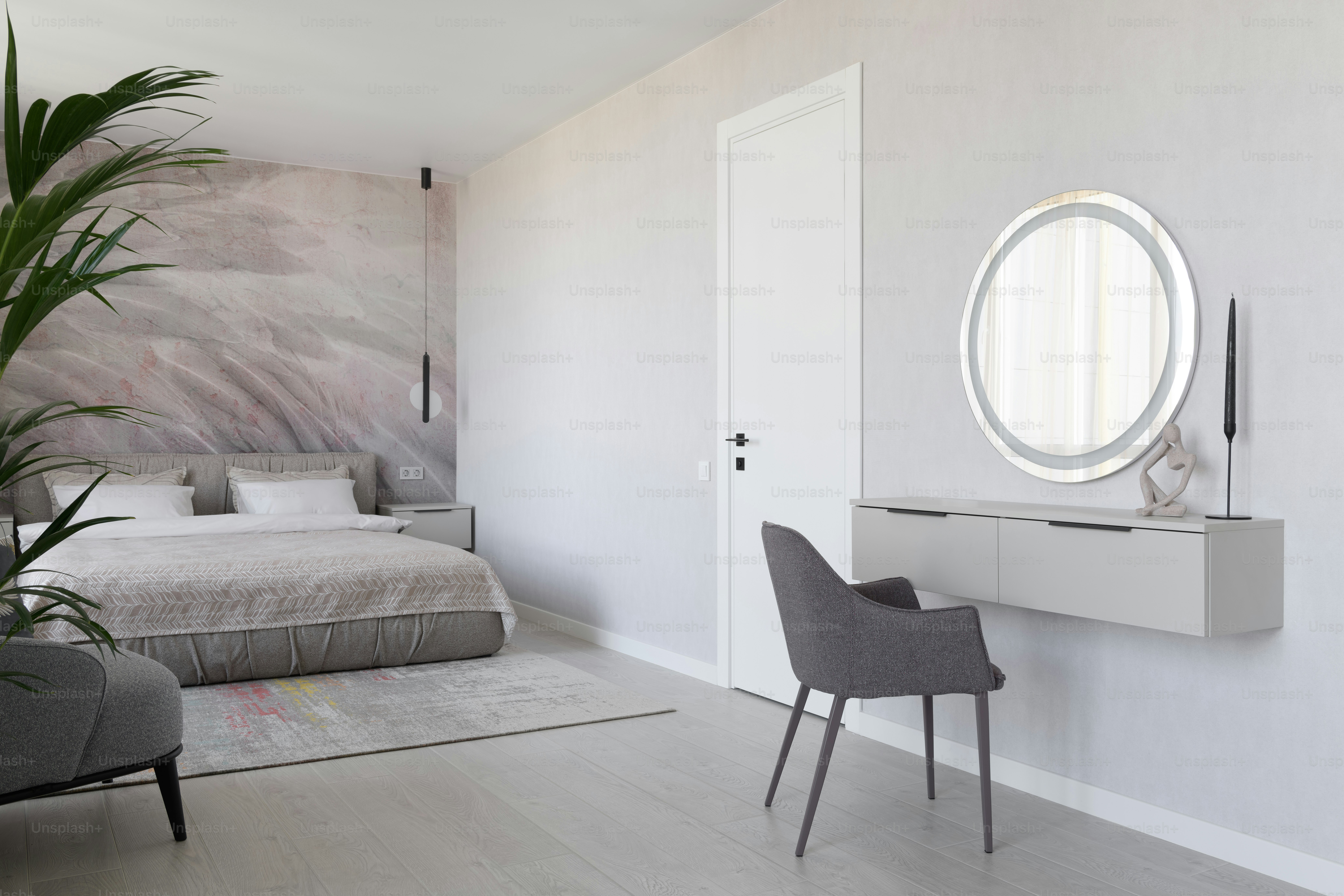 a room with a bed and a mirror